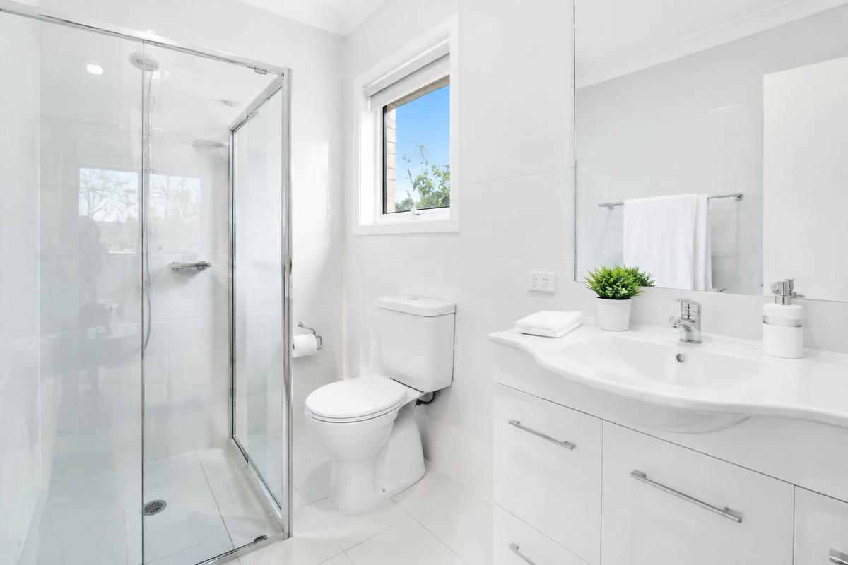 Freshly descaled bathroom with gleaming tiles
